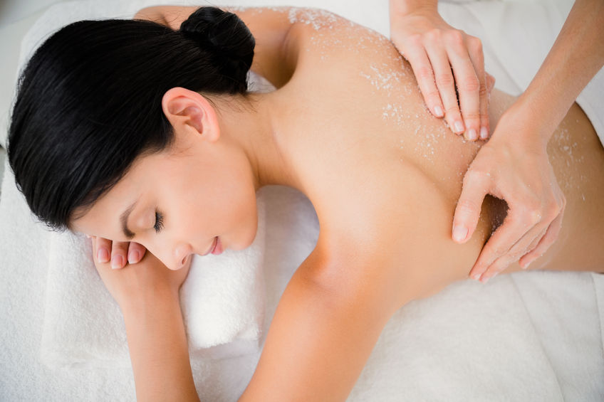 42397616 - woman enjoying a salt scrub massage at the health spa