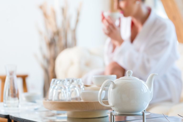 Woman drinking tea in wellness spa