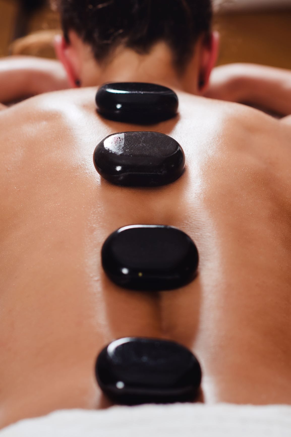 Stay Warm with a Hot Stone Massage This Winter Botanica Day Spa